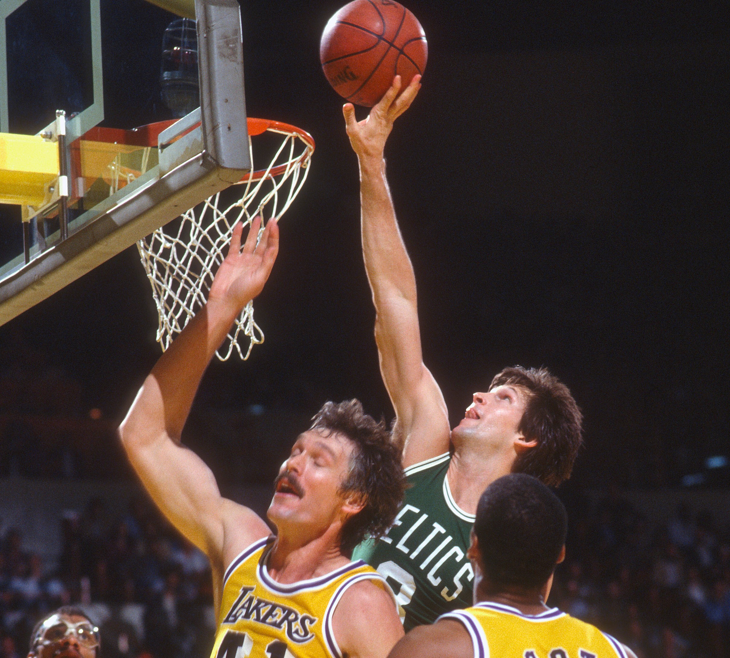 Scott Wedman of the Boston Celtics tips the ball in against the Los Angeles Lakers.