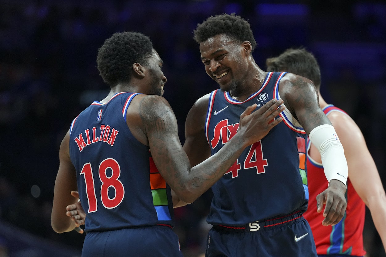 Shake Milton and Paul Reed celebrate during a game against the Pistons.