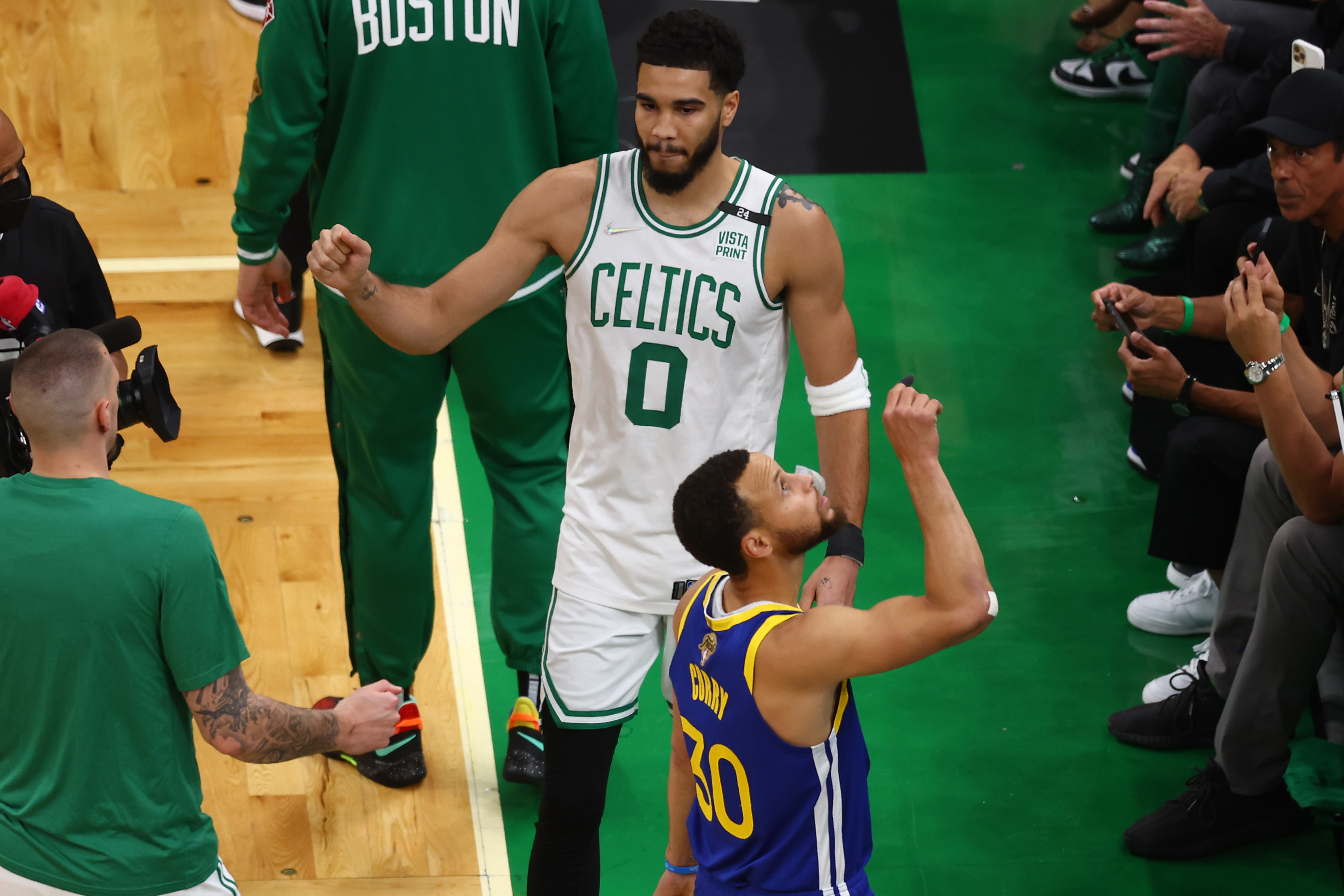 Jayson Tatum of the Boston Celtics and Stephen Curry of the Golden State Warriors look on prior to Game 6 of the 2022 NBA Finals.