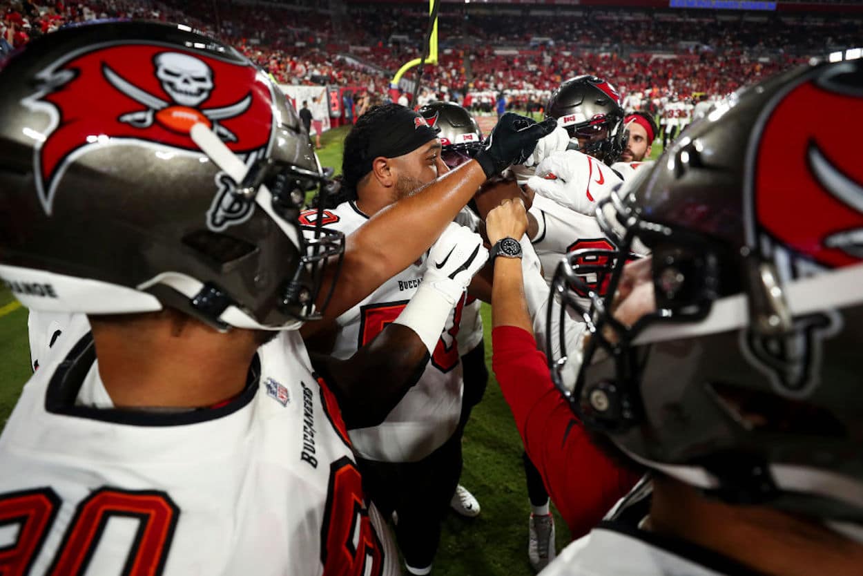 The Tampa Bay Buccaneers defensive line huddles.