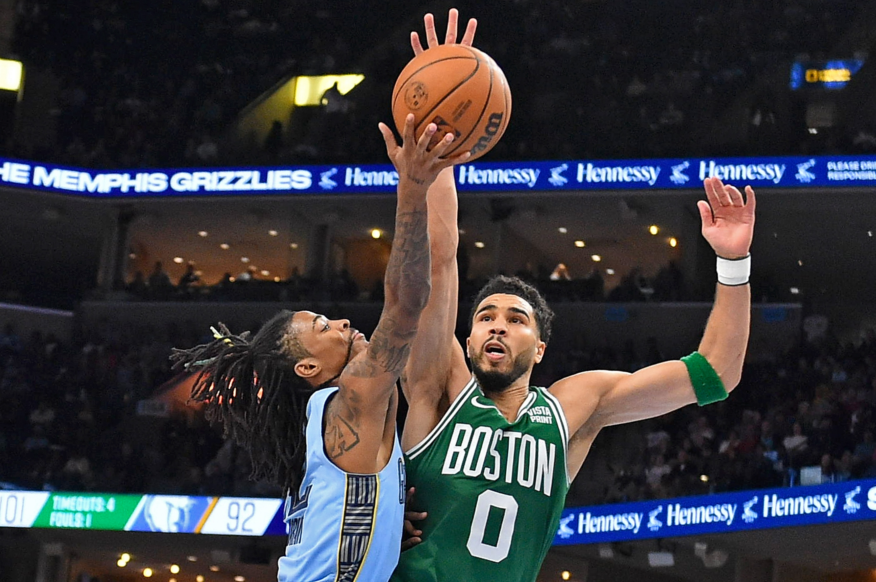 Ja Morant of the Memphis Grizzlies goes to the basket against Jayson Tatum of the Boston Celtics.