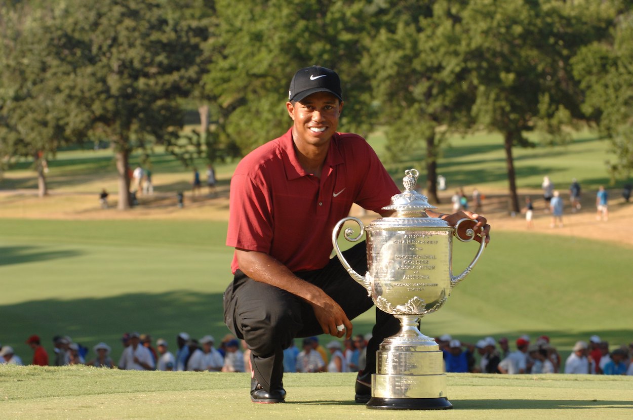 Tiger Woods poses with the trophy after winning the 2007 PGA Championship.