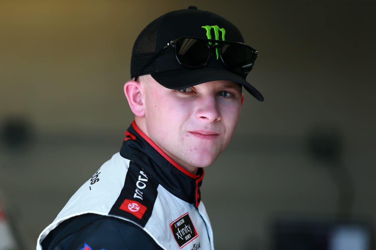 Ty Gibbs waits in the garage area during practice for the NASCAR Xfinity Series Pennzoil 150 at the Brickyard at Indianapolis Motor Speedway on Aug 13, 2021. | Sean Gardner/Getty Images