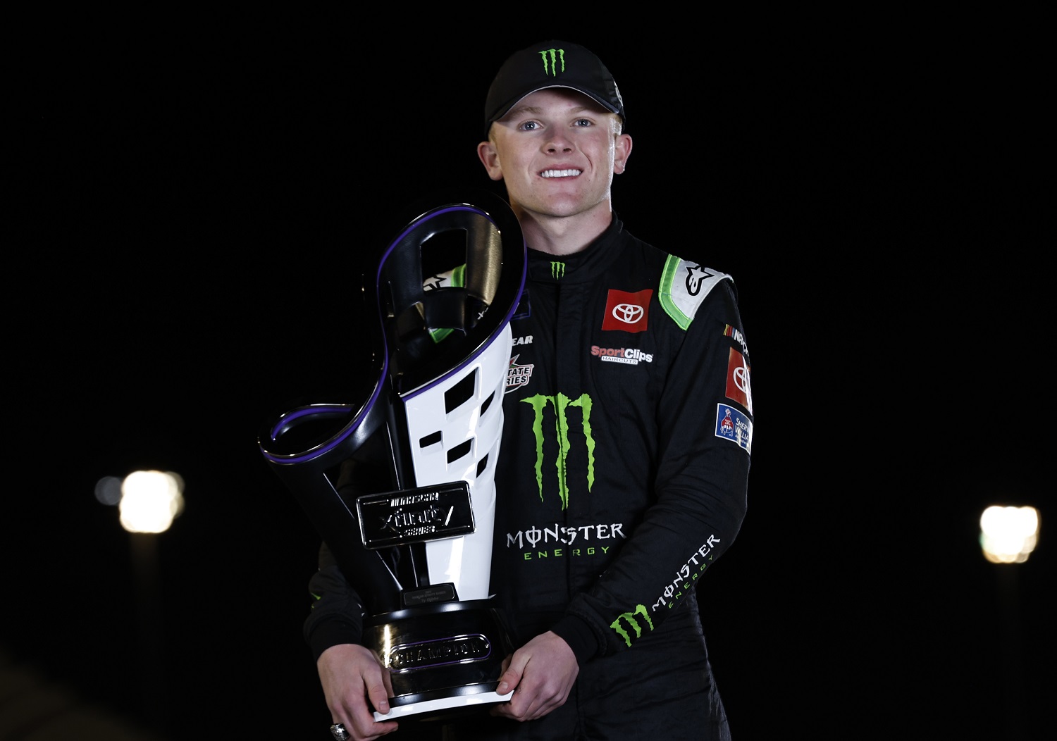 Ty Gibbs poses with the 2022 NASCAR Xfinity Series Championship trophy after winning at Phoenix Raceway on Nov. 5, 2022. | Meg Oliphant/Getty Images