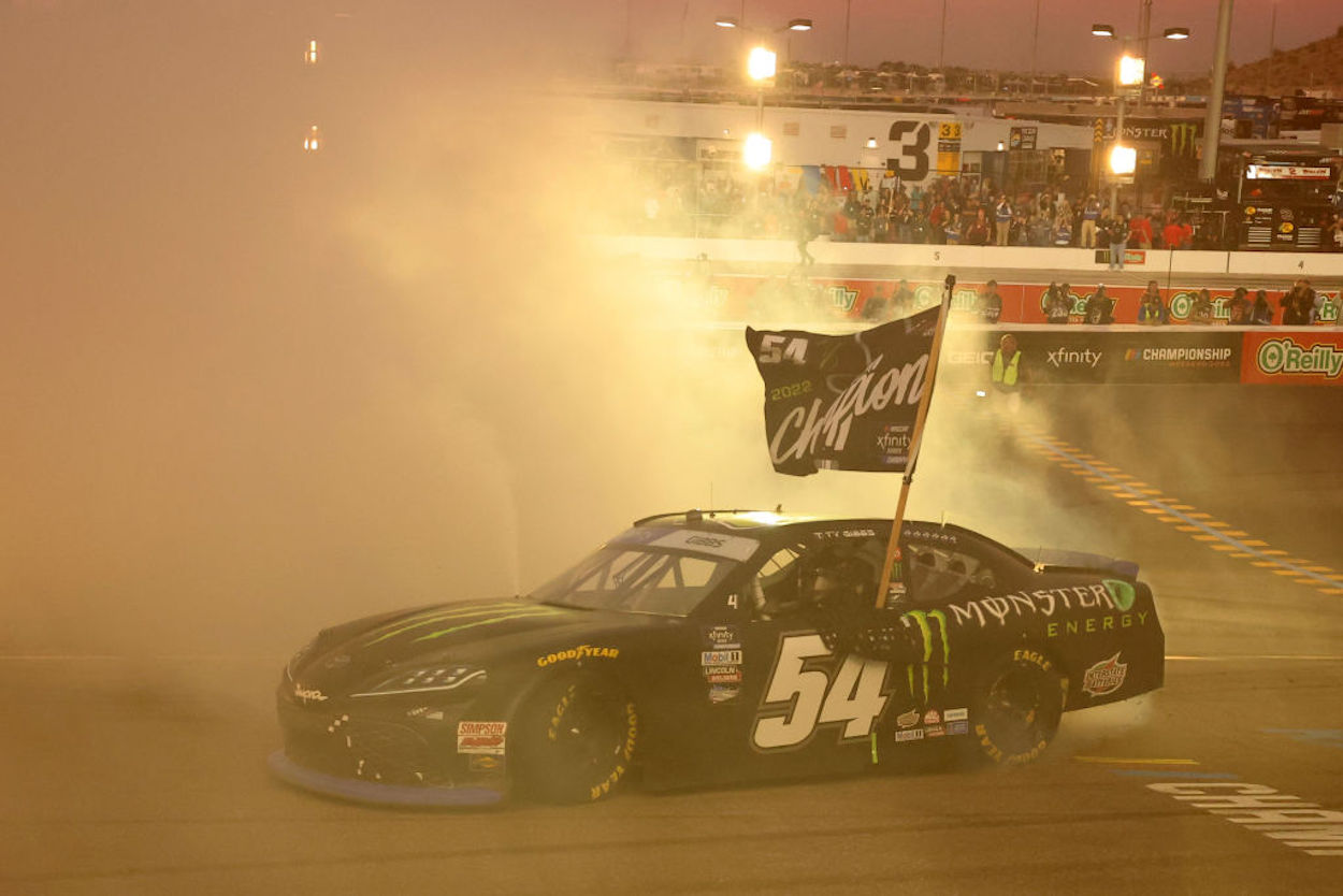 Ty Gibbs performs a celebratory burnout in his number 54 car.