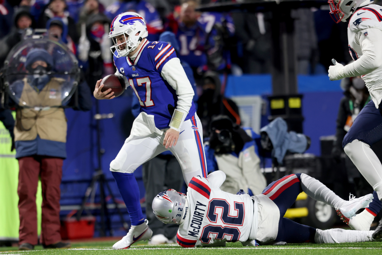 Josh Allen of the Buffalo Bills is tackled by Devin McCourty of the New England Patriots.