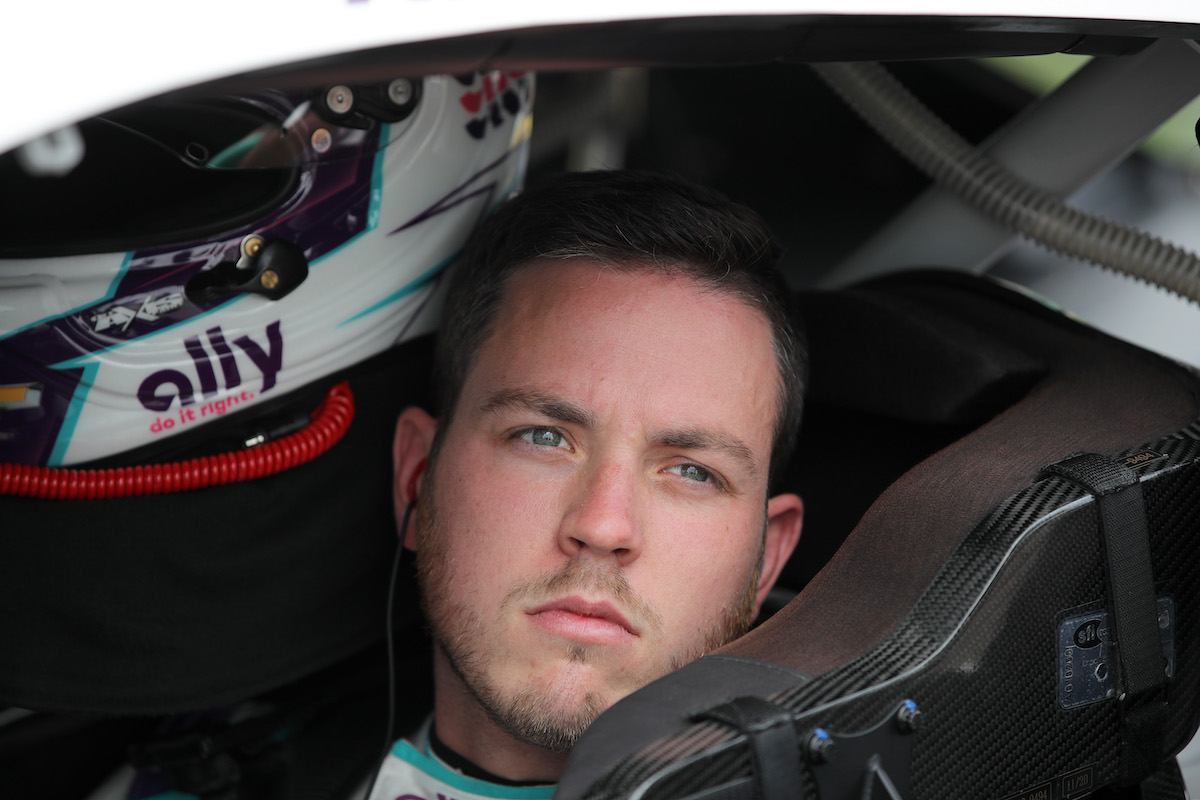 Alex Bowman, Ally Chevrolet driver, sits in his car during qualifying for the NASCAR Cup Series Hollywood Casino 400
