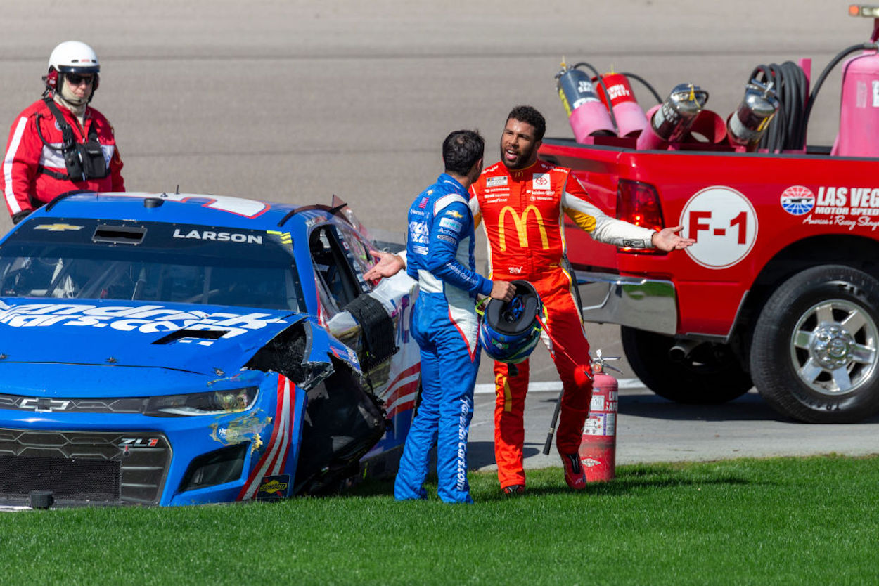 Bubba Wallace (R) confronts Kyle Larson (L) after a crash at Las Vegas Motor Speedway.
