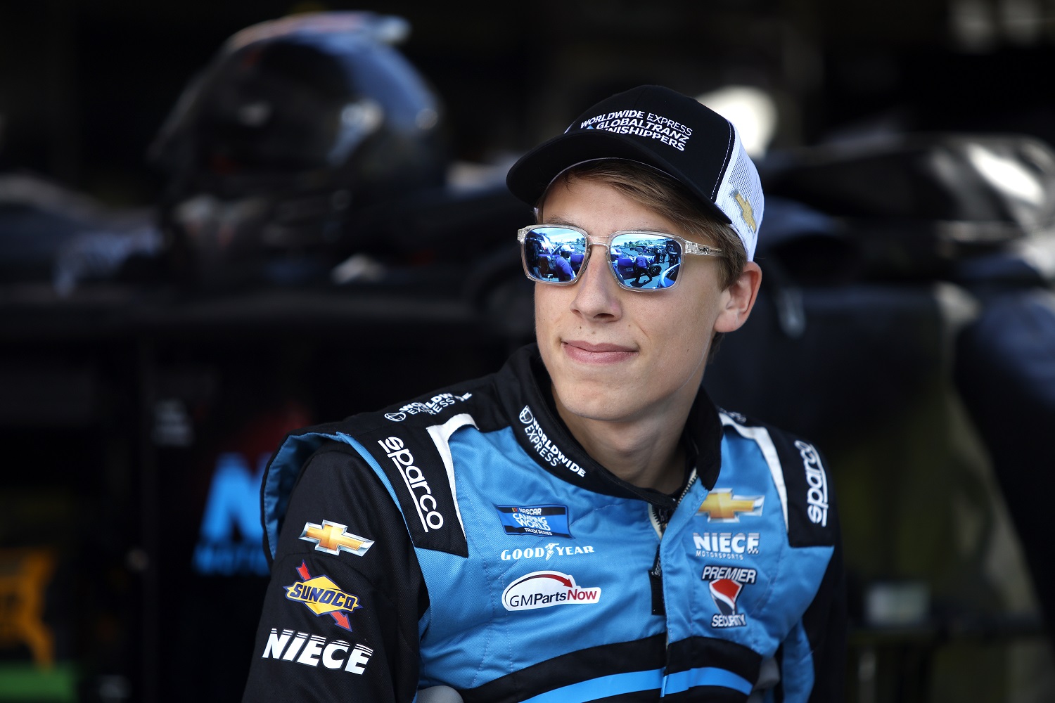 Carson Hocevar waits in the garage area during practice for the NASCAR Camping World Truck Series DoorDash 250 at Sonoma Raceway on June 10, 2022. | Sean Gardner/Getty Images
