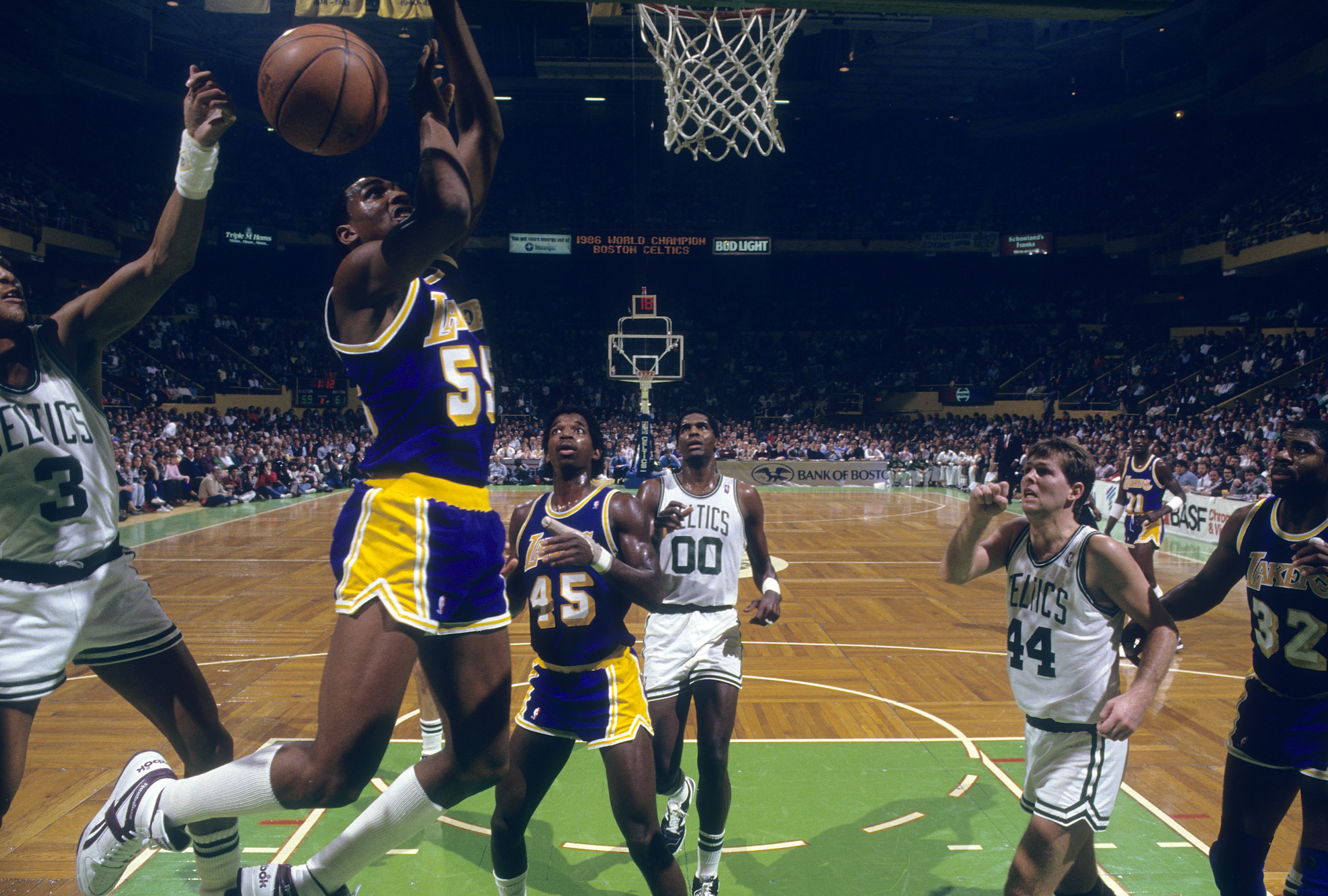 Billy Thompson of the Los Angeles Lakers battles for a rebound with Dennis Johnson of the Boston Celtics.
