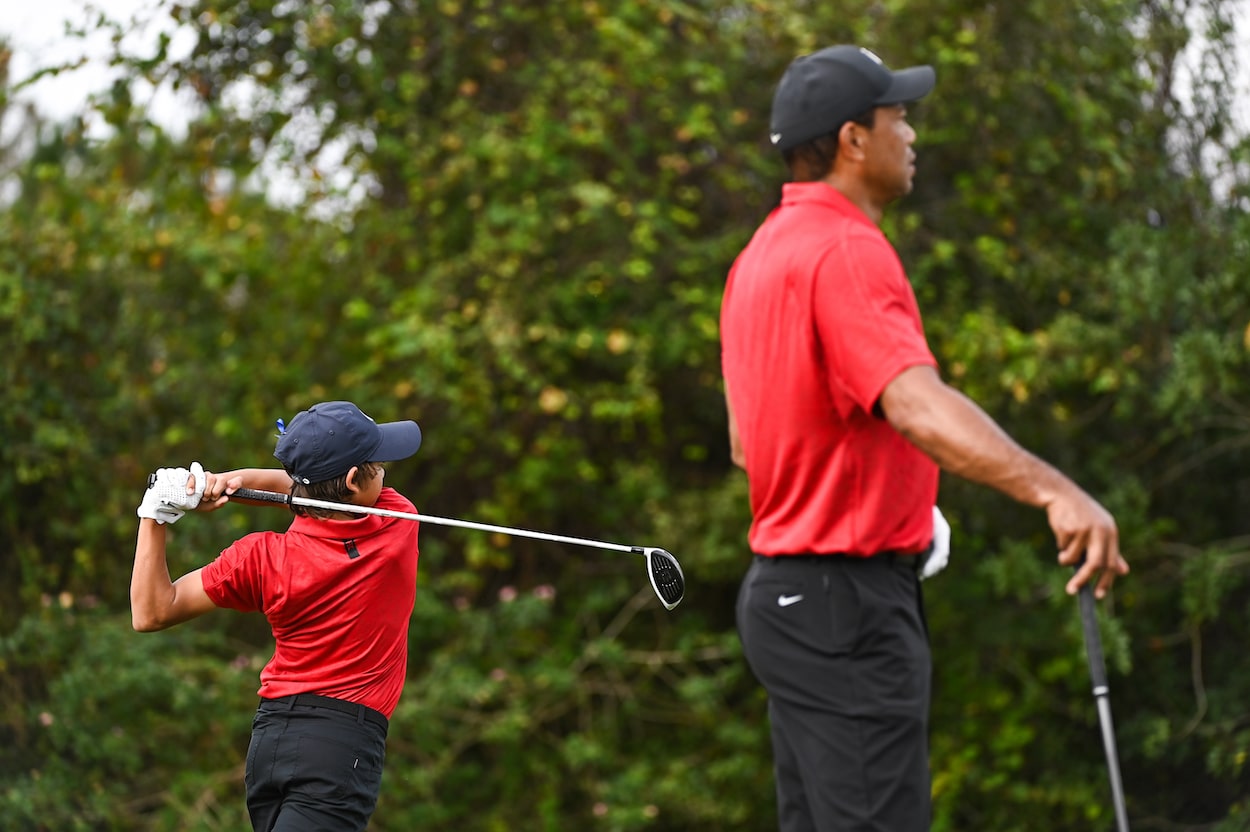 Tiger and Charlie Woods warm up on the range.