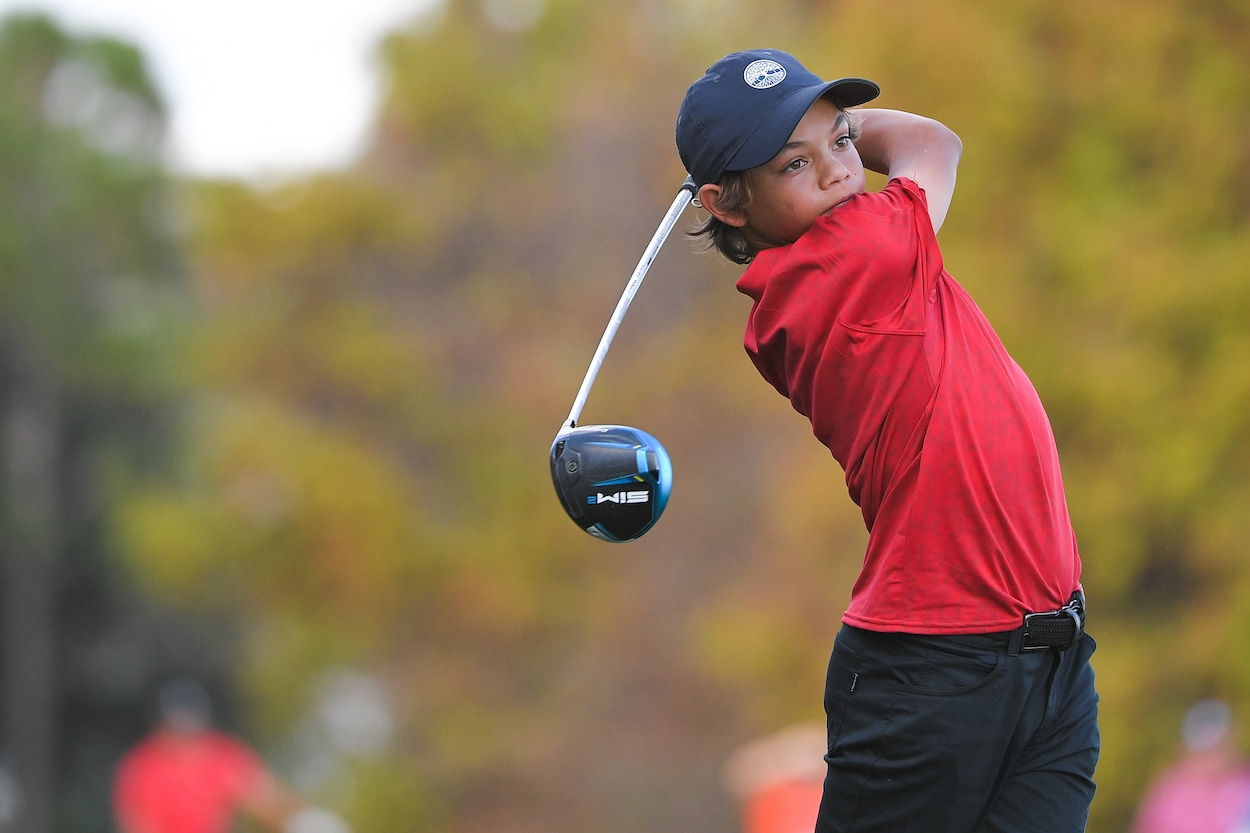 Charlie Woods tees off during the 2021 PNC Championship.