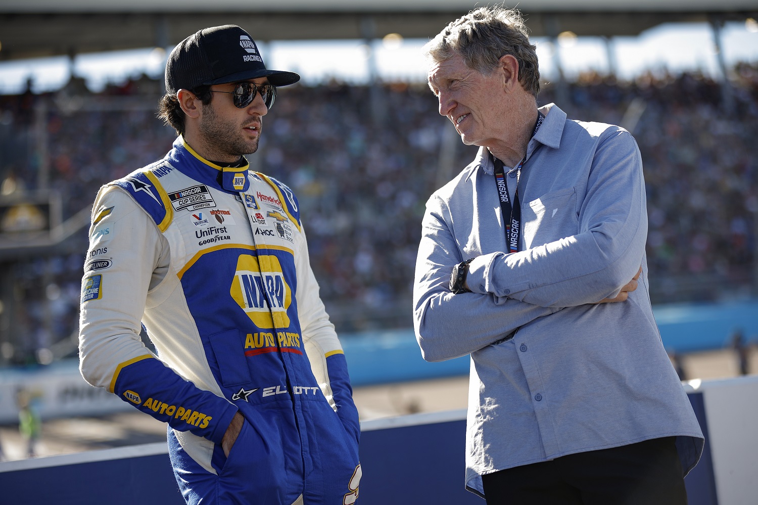 Chase Elliott talks to his father, Hall of Famer Bill Elliott, on the grid prior to the NASCAR Cup Series Championship at Phoenix Raceway on Nov. 6, 2022.