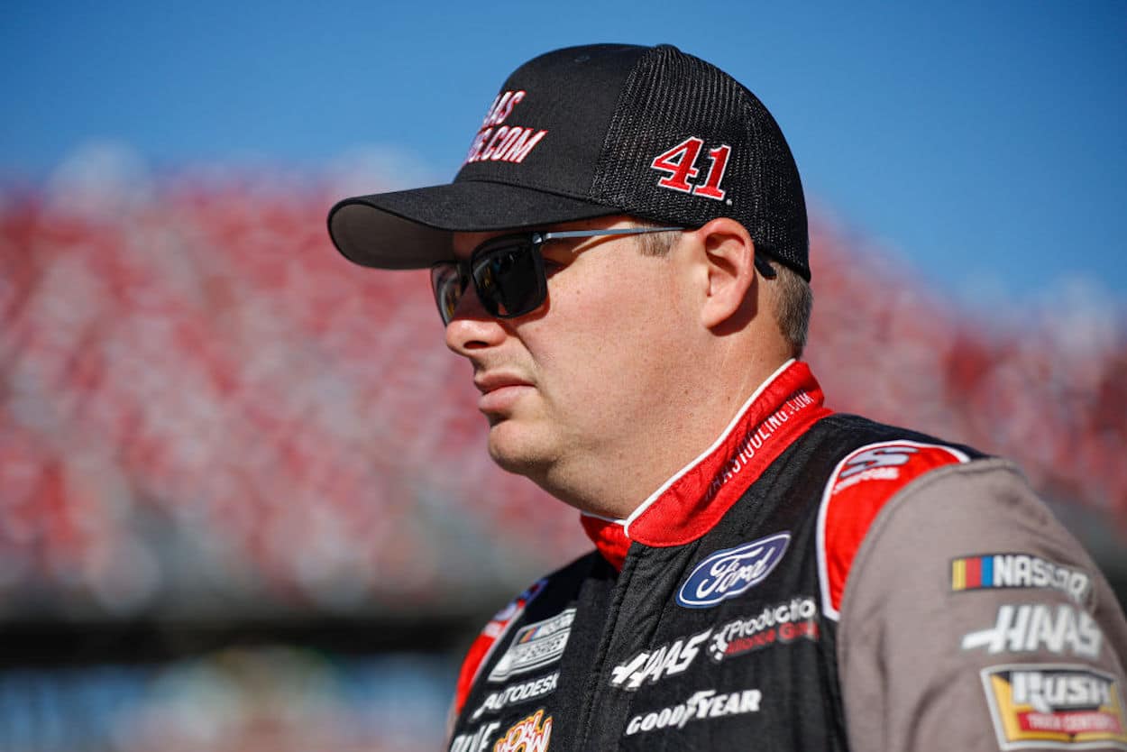 Cole Custer walks the grid during qualifying for the NASCAR Cup Series YellaWood 500 at Talladega Superspeedway.