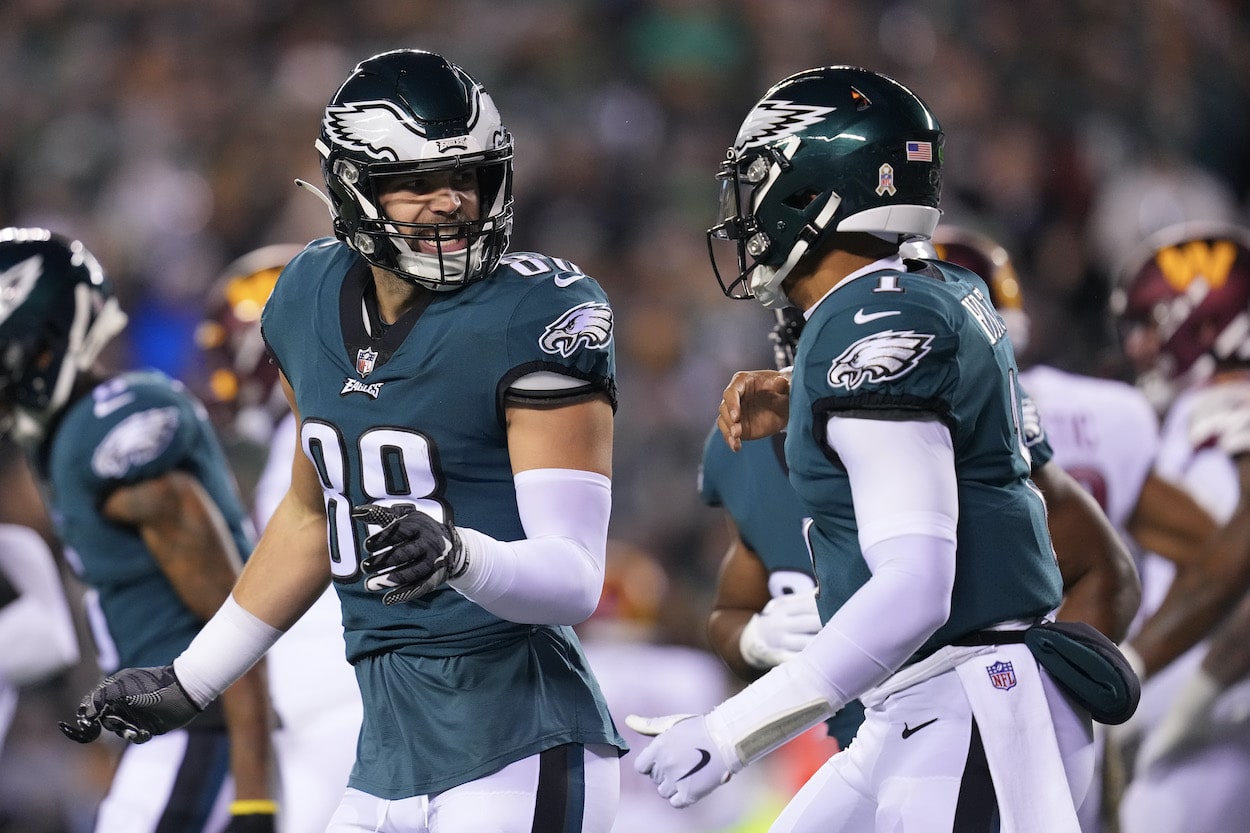 Dallas Goedert and Jalen Hurts celebrate during a game.