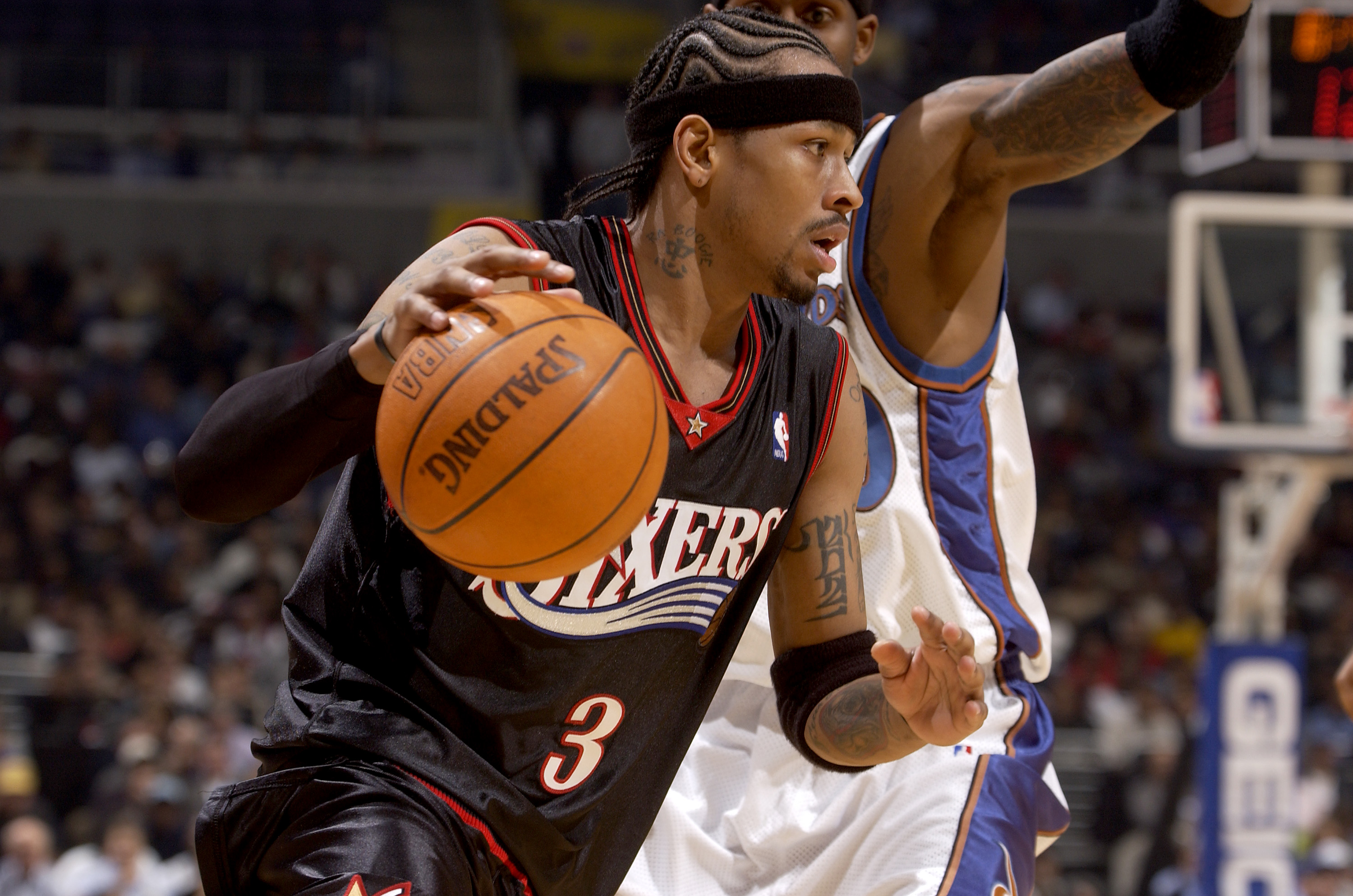 Denver Nuggets guard Allen Iverson (R) greets Philadelphia 76ers