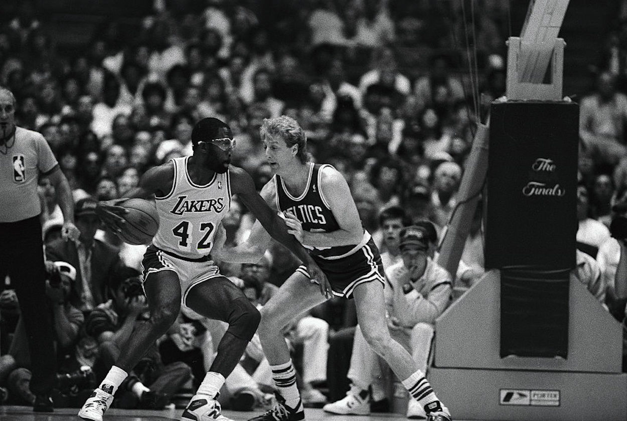 Larry Bird (R) defends against James Worthy (L) during the 1984 NBA Finals.