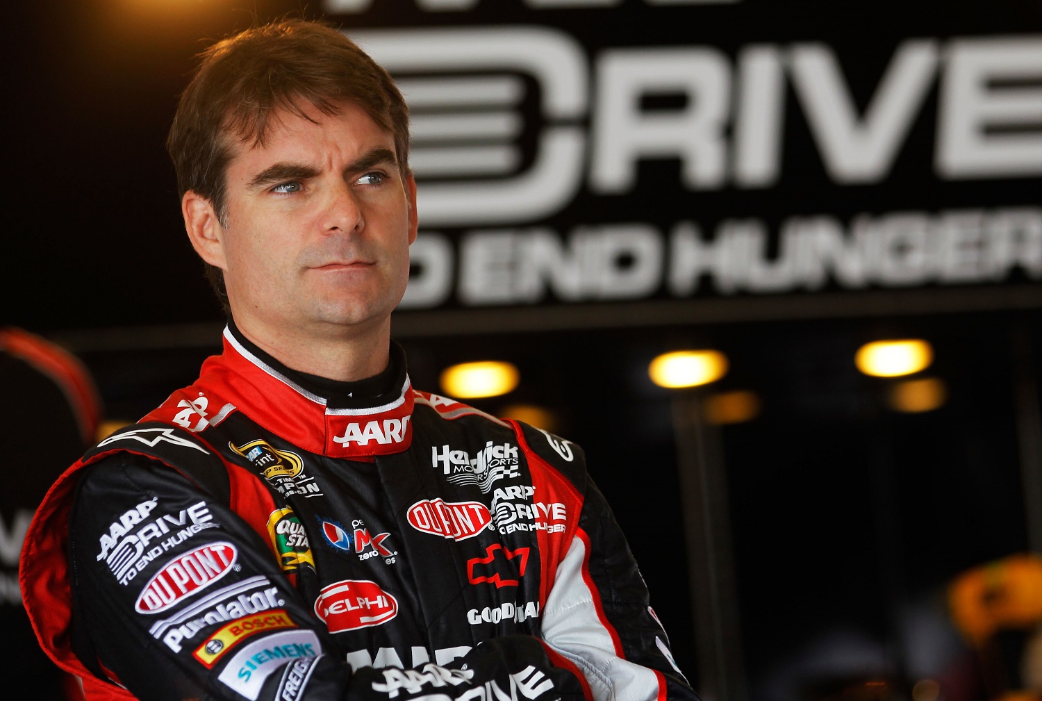 Jeff Gordon looks on in the garage during practice for the Daytona 500 at Daytona International Speedway on Feb. 22, 2012. | Todd Warshaw/Getty Images for NASCAR