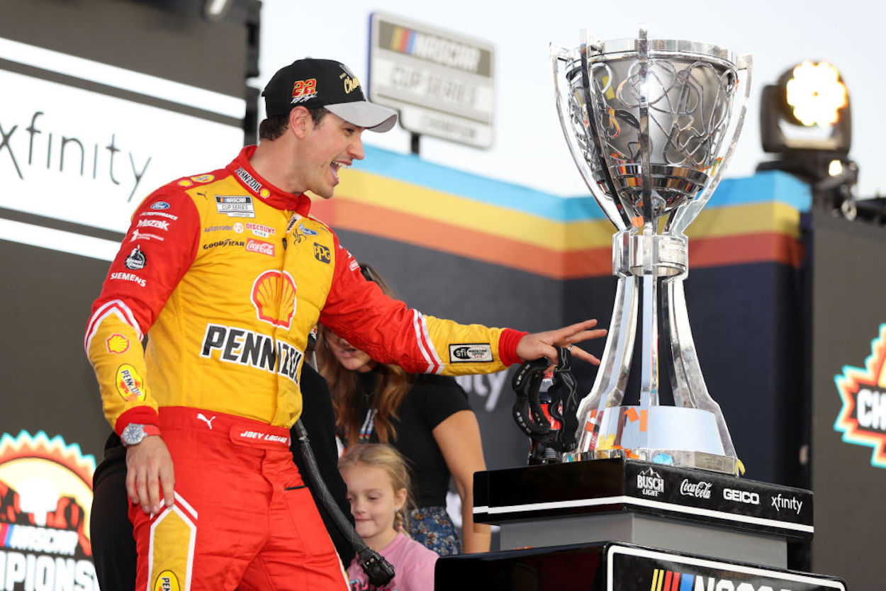 Joey Logano celebrates winning the 2022 NASCAR Cup Series title.