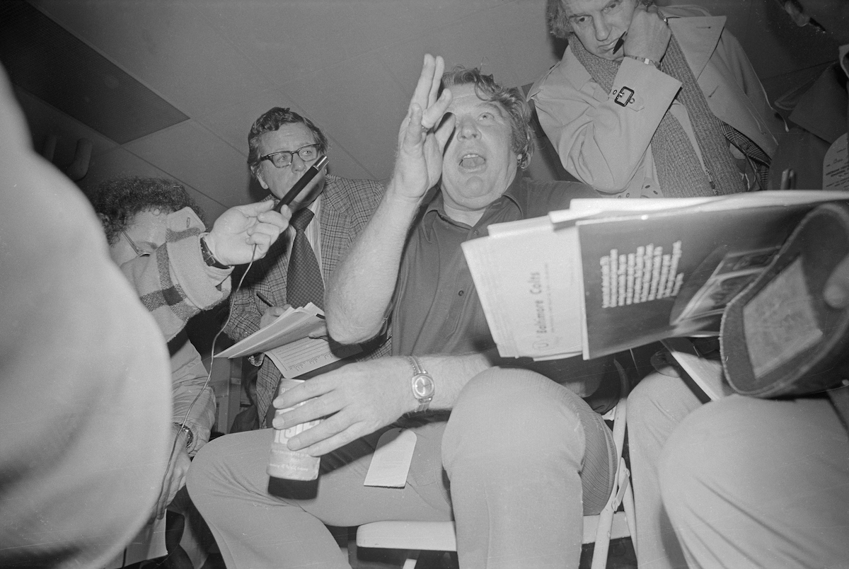 Oakland Raiders coach John Madden exuberantly talks to reporters after defeating the Colts in the infamous "Ghost in the Post" game on Christmas Eve