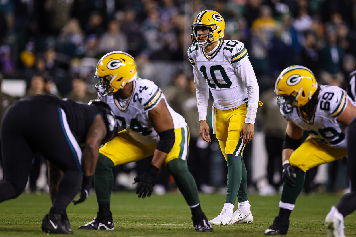 Jordan Love of the Green Bay Packers looks over the defense.