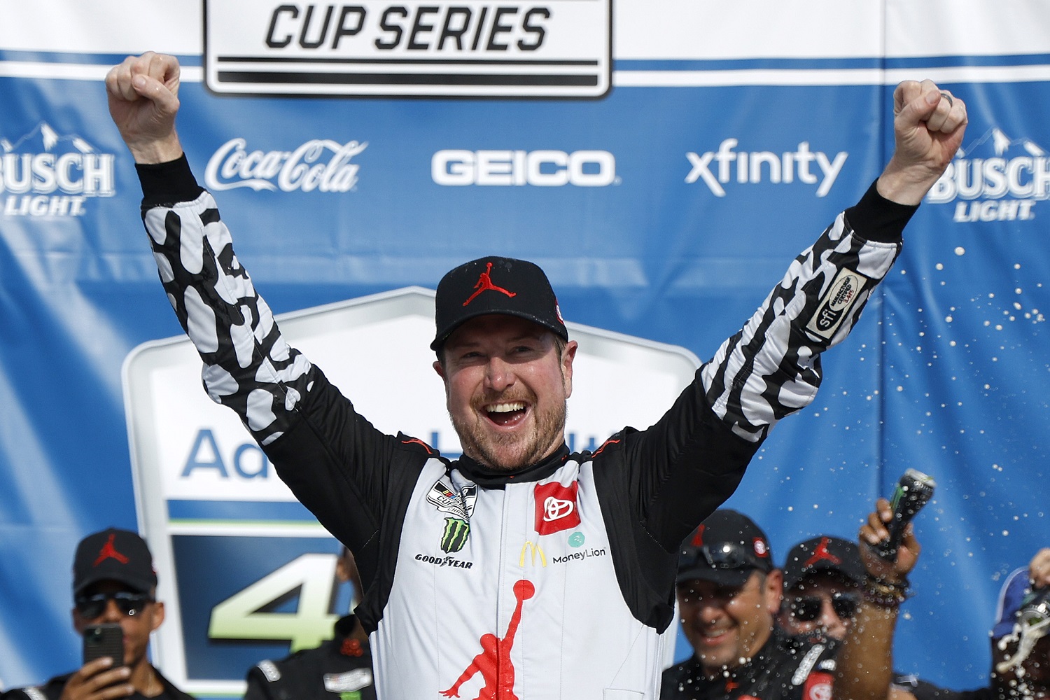 Kurt Busch celebrates in Victory Lane after winning the NASCAR Cup Series AdventHealth 400 at Kansas Speedway on May 15, 2022.