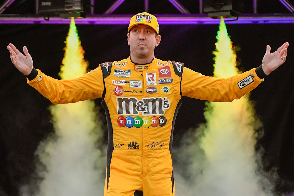 Kyle Busch walks on stage ahead of the NASCAR Cup Series Bass Pro Shops Night Race