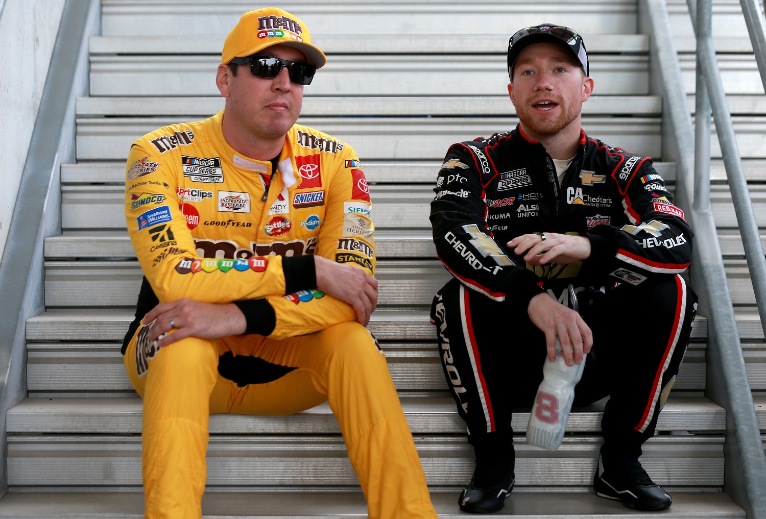 Kyle Busch and Tyler Reddick talk prior to the NASCAR Cup Series Verizon 200 at the Brickyard at Indianapolis Motor Speedway on Aug. 15, 2021.