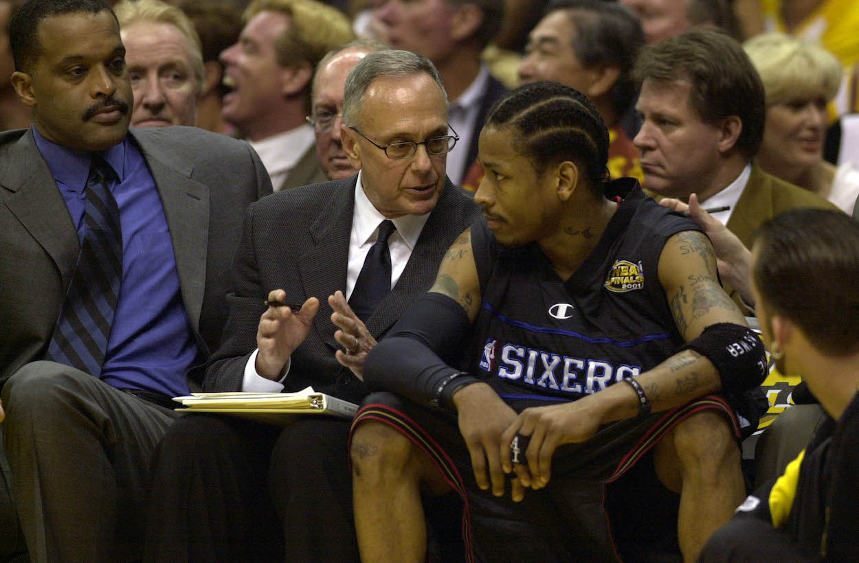 Allen Iverson talks to Larry Brown on the bench.