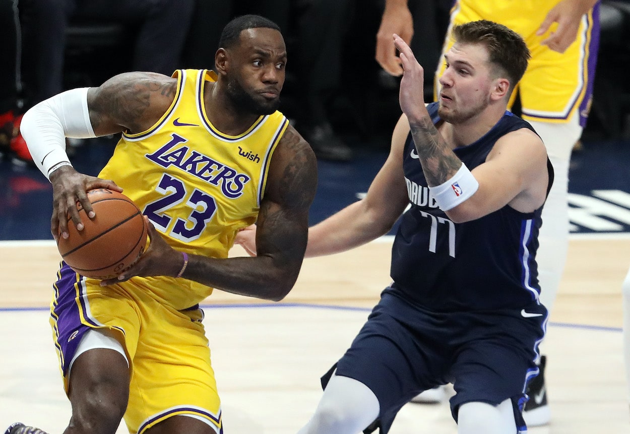 LeBron James drives against Luka Doncic.