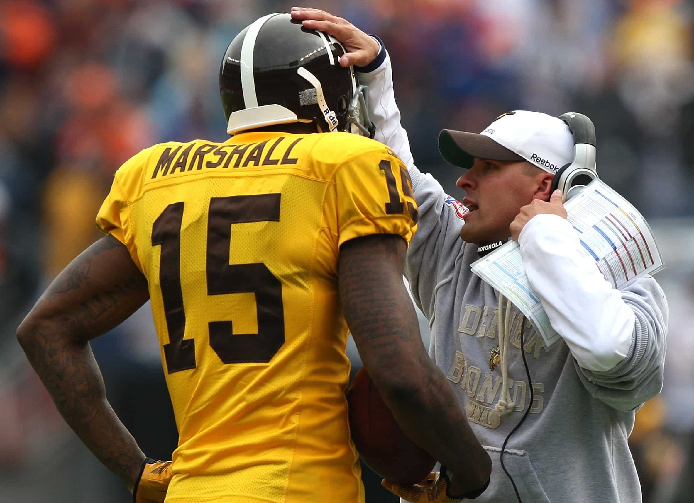 Brandon Marshall of the Denver Broncos is congratulated by head coach Josh McDaniels.