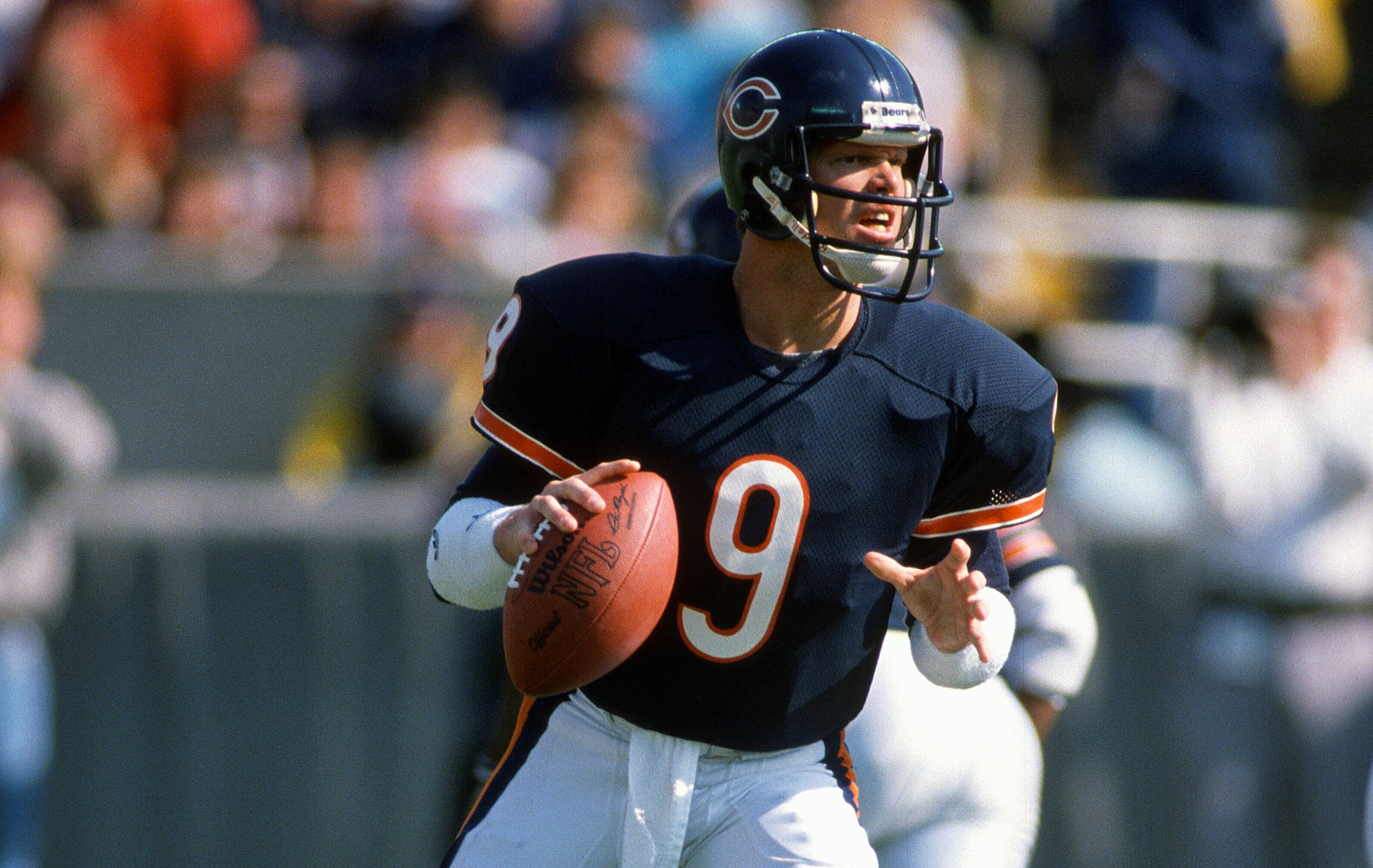 Jim McMahon of the Chicago Bears drops back to pass.