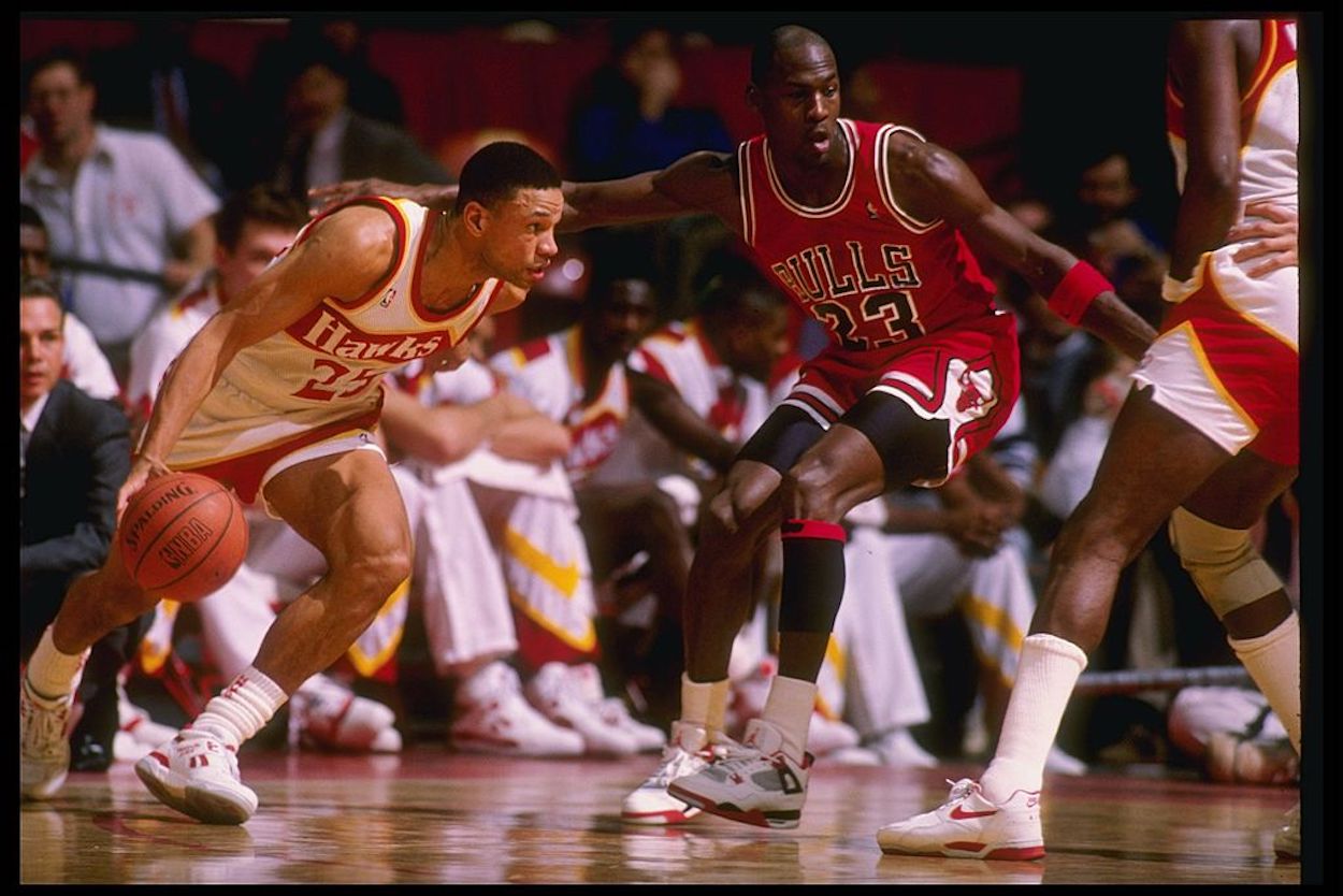 Doc Rivers (L) and Michael Jordan (R) face off during their playing careers.