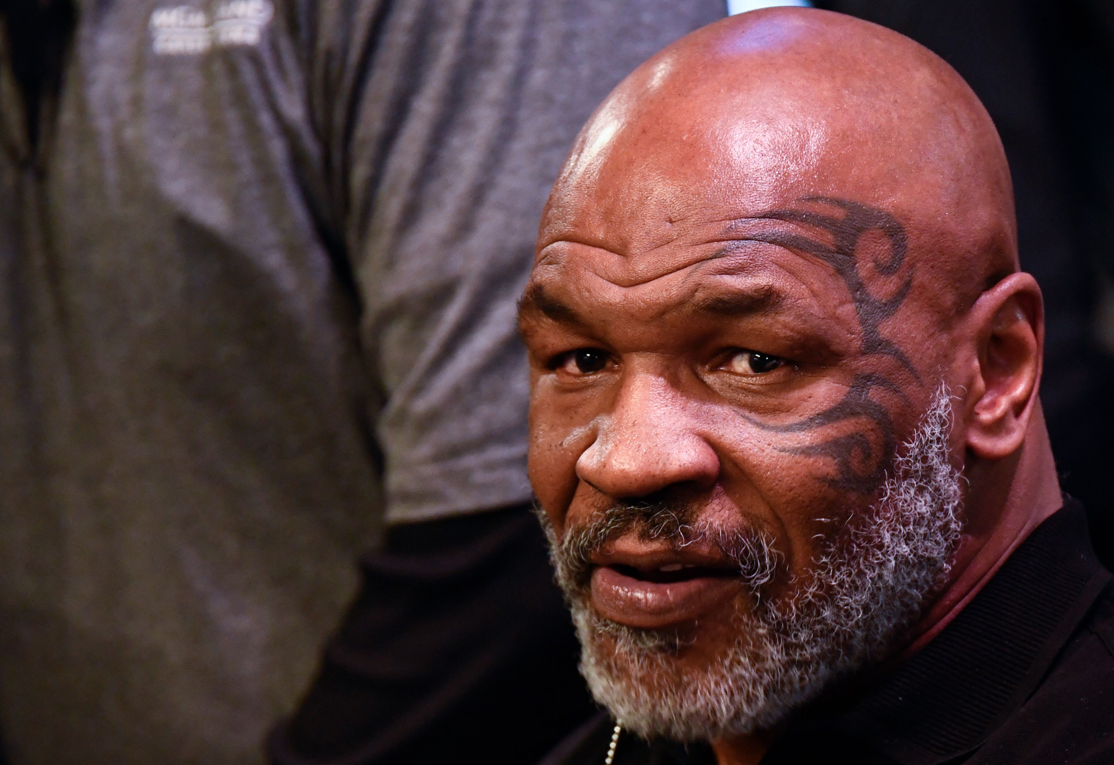 Mike Tyson looks on during the weigh-in for boxers Canelo Alvarez and Caleb Plant.