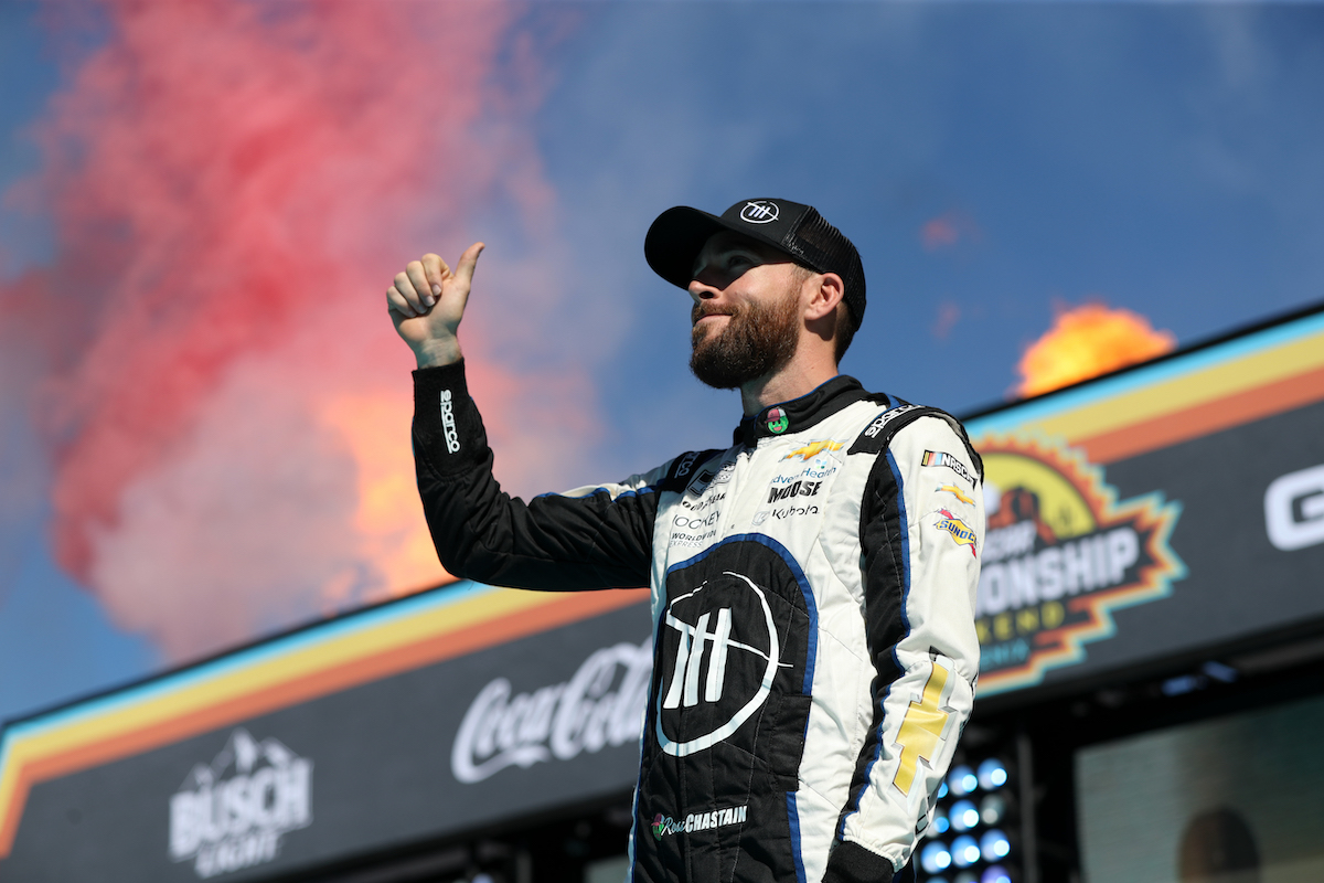 Ross Chastain, driver of the #1 Worldwide Express/Advent Health Chevrolet, gives a thumbs up to fans onstage during the Championship 4 driver intros