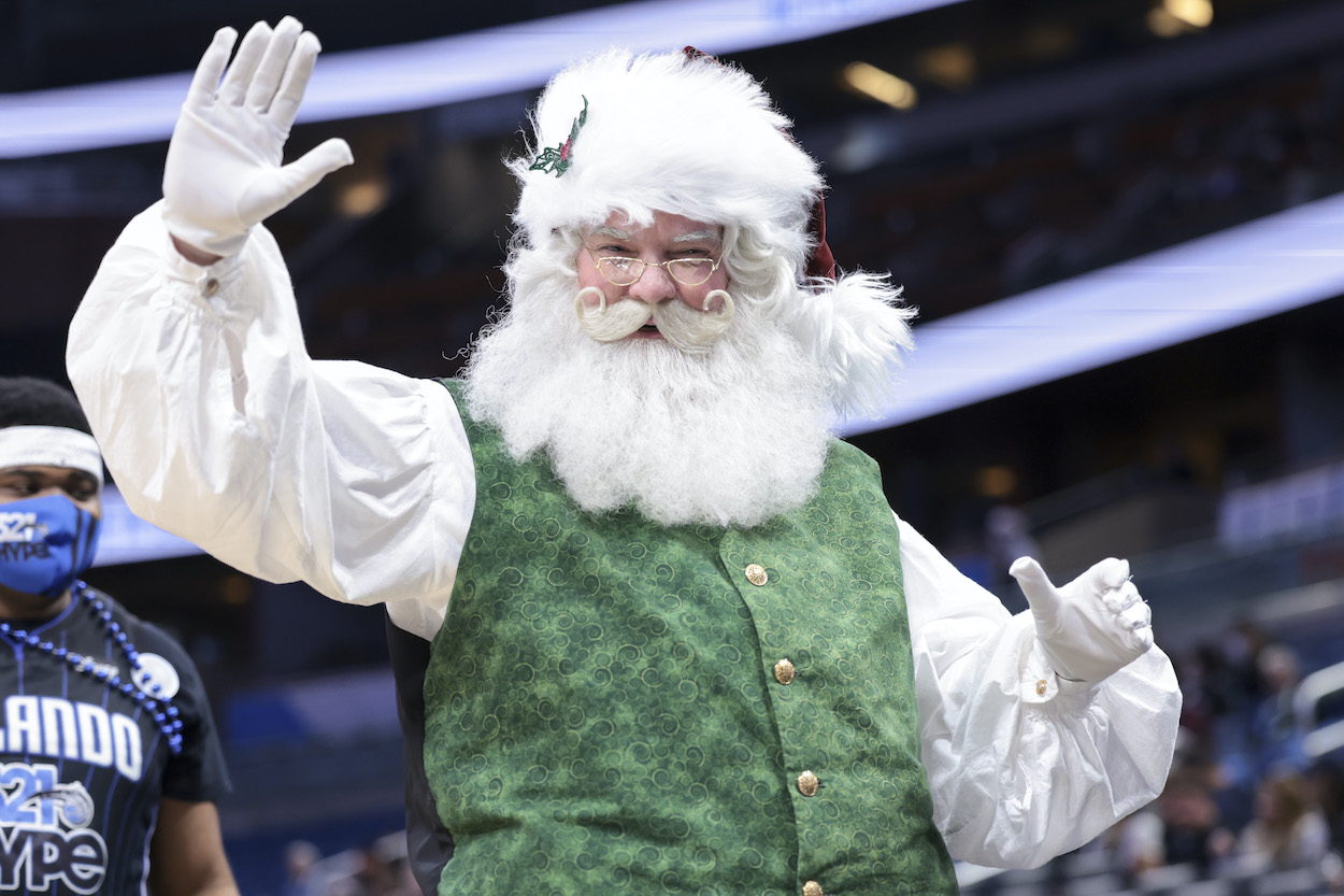 Santa Claus waves during an NBA Christmas Day game.