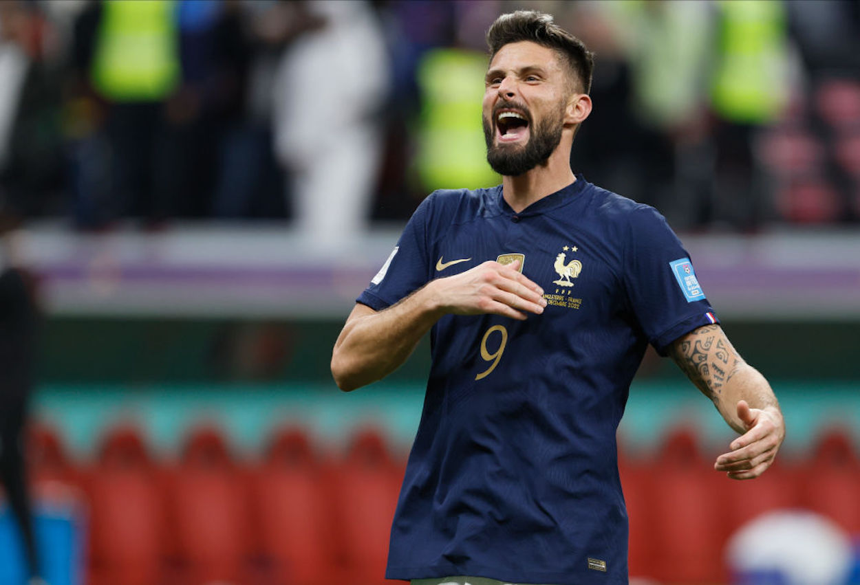 Olivier Groud celebrates scoring a goal for France at the 2022 FIFA World Cup.