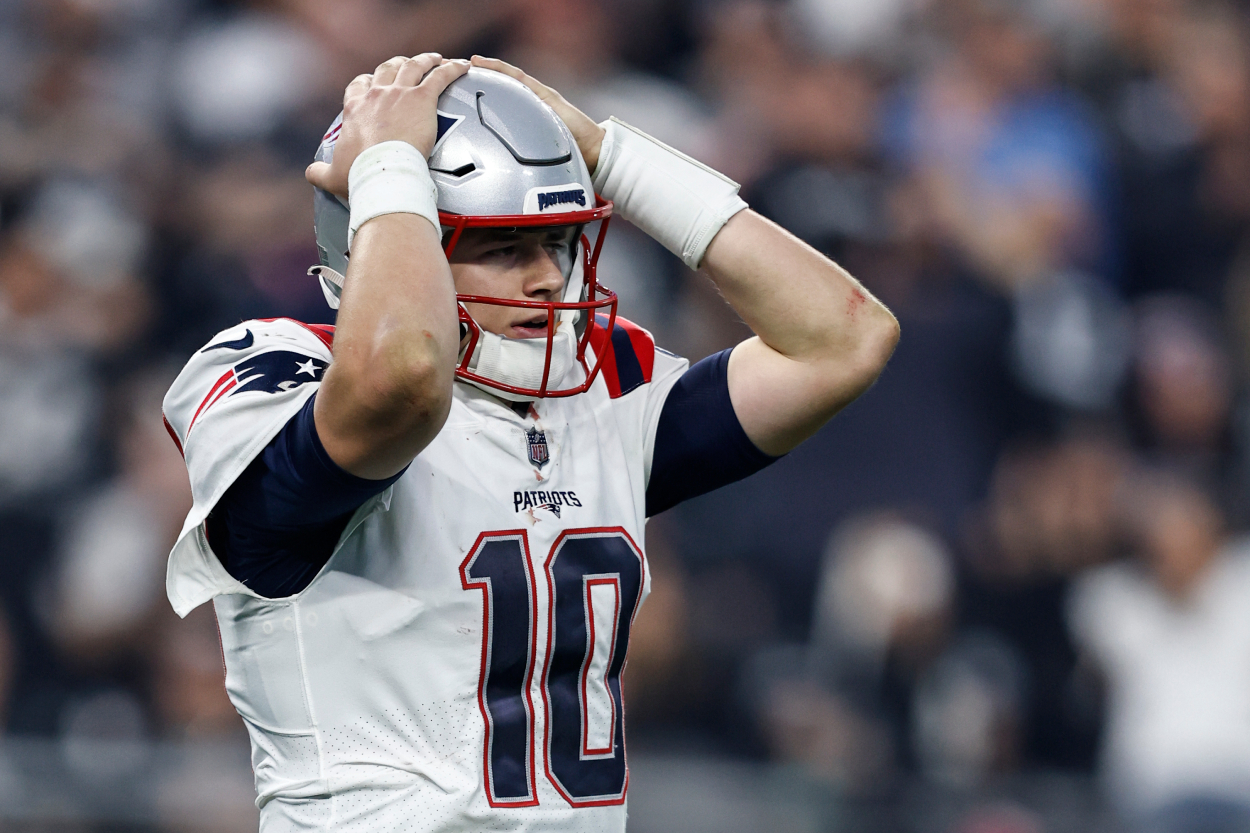Mac Jones of the New England Patriots reacts during an NFL game against the Las Vegas Raiders.