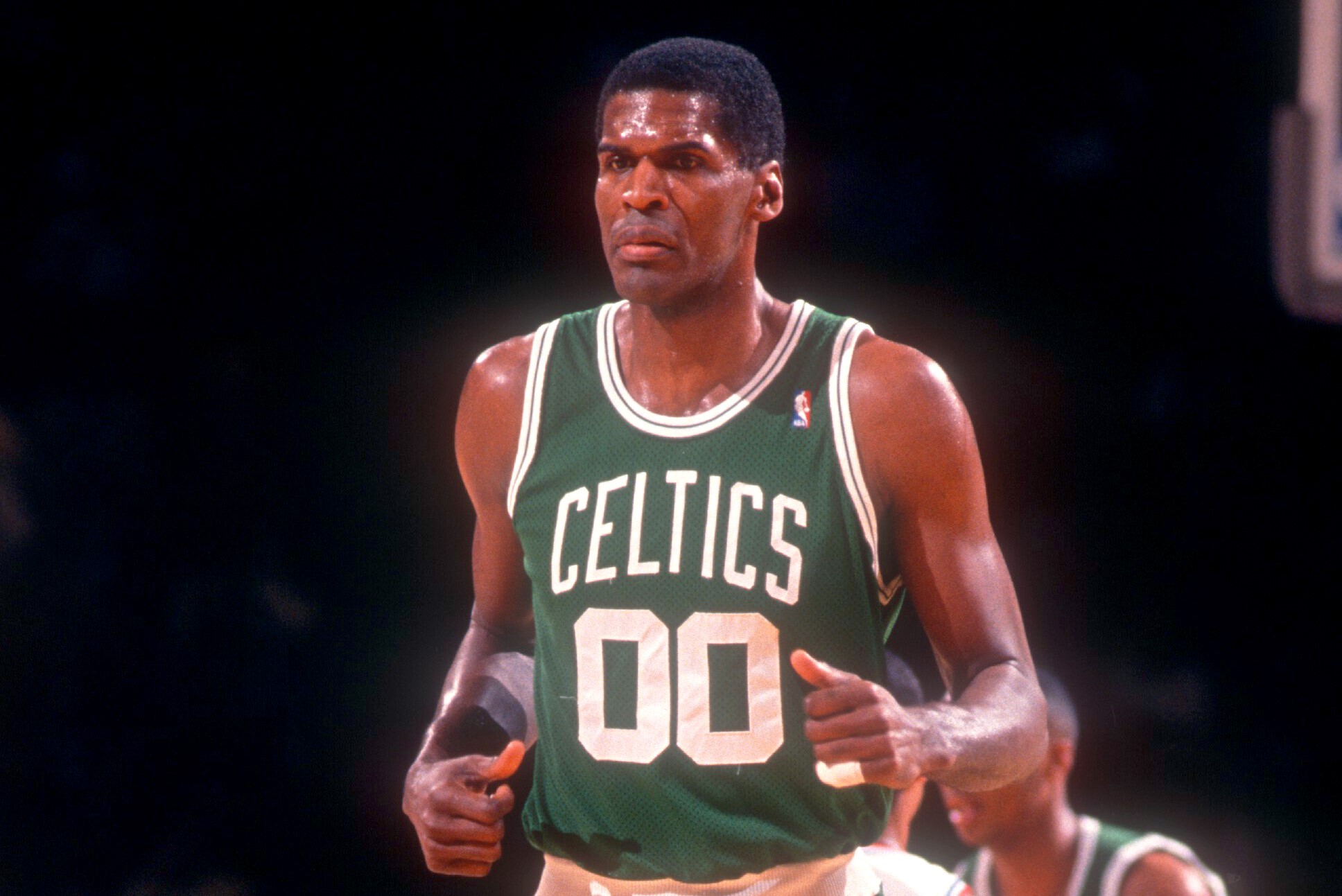 Robert Parish of the Boston Celtics runs up the court.
