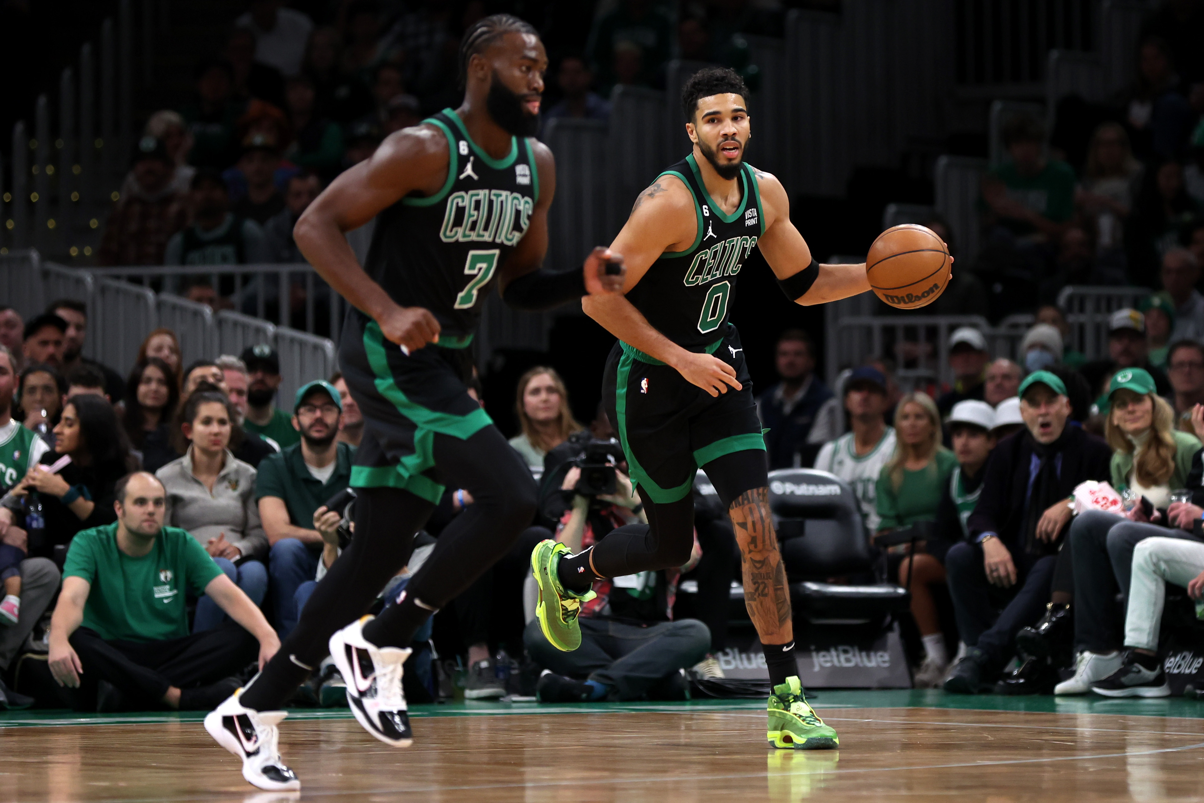 Jayson Tatum of the Boston Celtics dribbles downcourt next to Jaylen Brown during the first half of the game against the Cleveland Cavaliers at TD Garden on October 28, 2022, in Boston, Massachusetts.