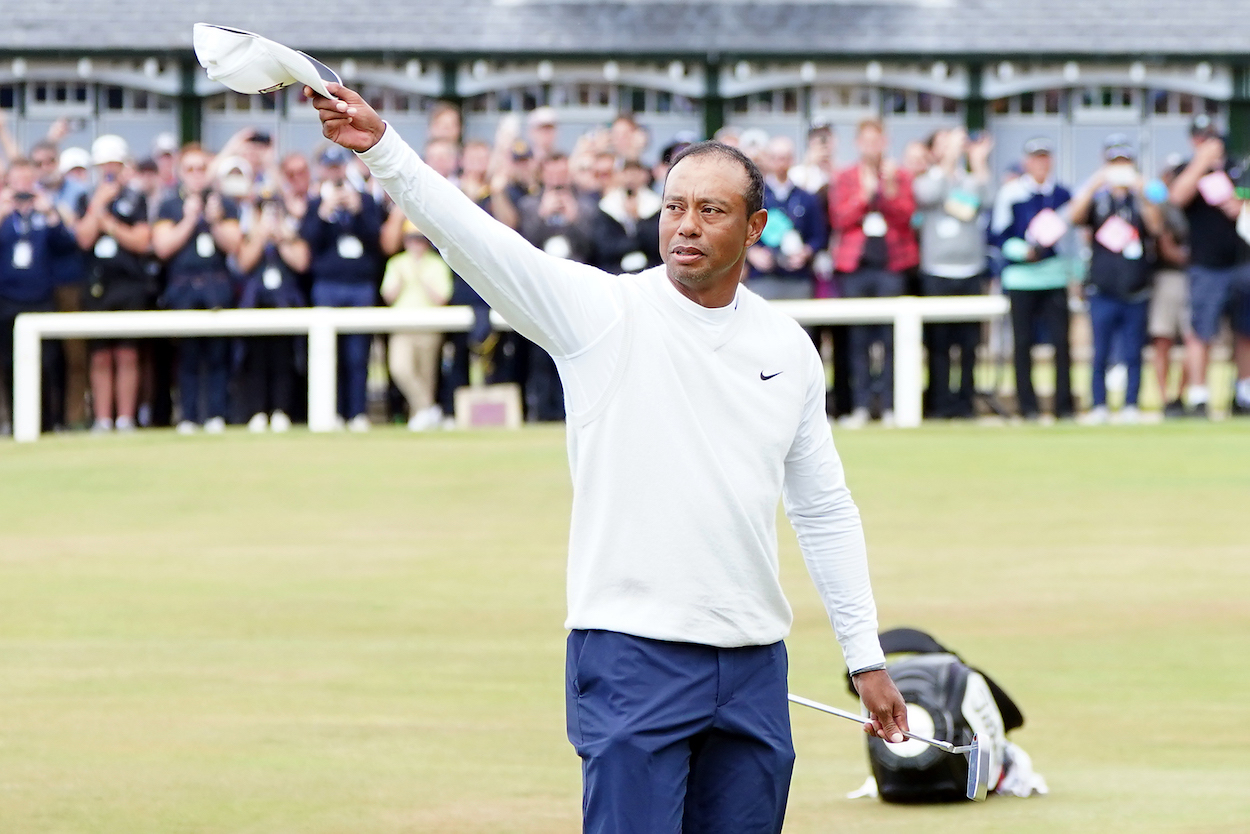 Tiger Woods waves to the crowd during the Open Championship.