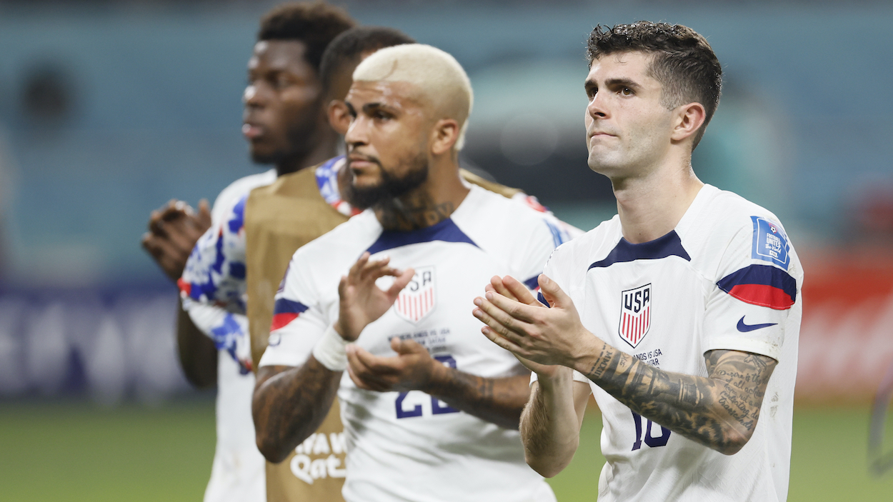 DeAndre Yedlin and Christian Pulisic of USMNT applaud the fans after the FIFA World Cup Qatar 2022 Round of 16 match between Netherlands and USA at Khalifa International Stadium on December 03, 2022 in Doha, Qatar.