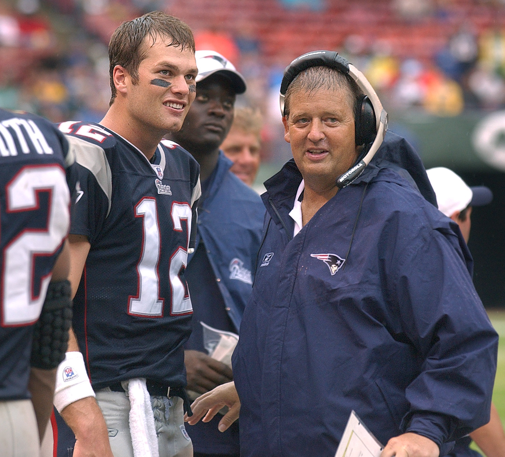 Patriots offensive coordinator Charlie Weis (right) and quarterback Tom Brady share a moment.