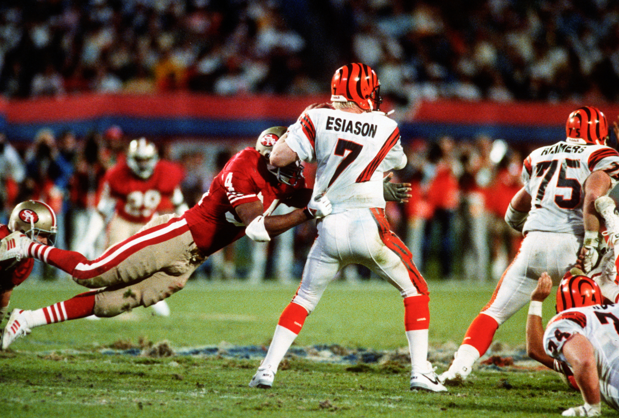 Boomer Esiason of the Cincinnati Bengals looks to get a pass off.