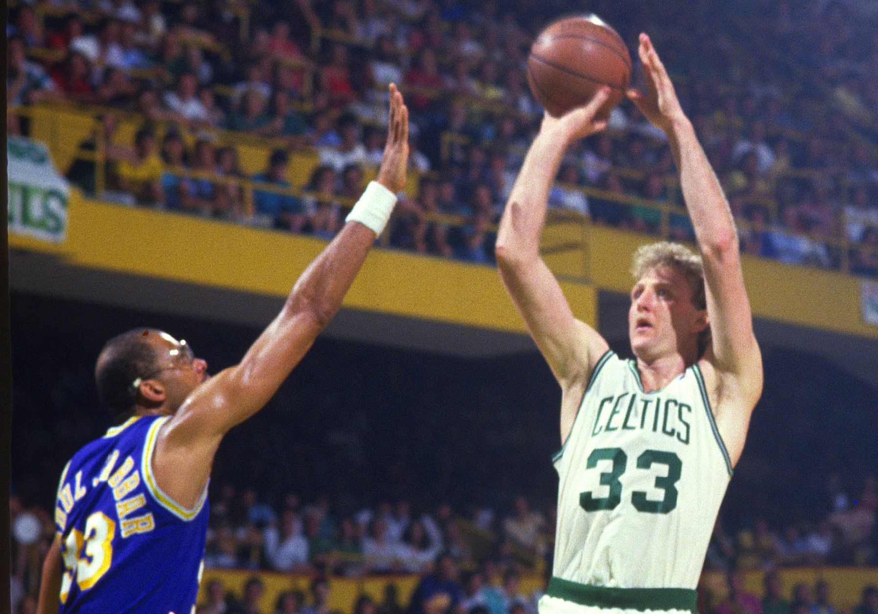 Larry Bird of the Boston Celtics shoots over Kareem Abdul-Jabbar of the Los Angeles Lakers.