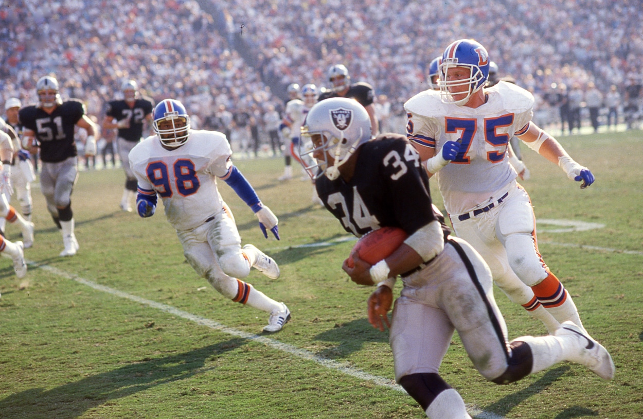 Bo Jackson of the Los Angeles Raiders rushes against the Denver Broncos.