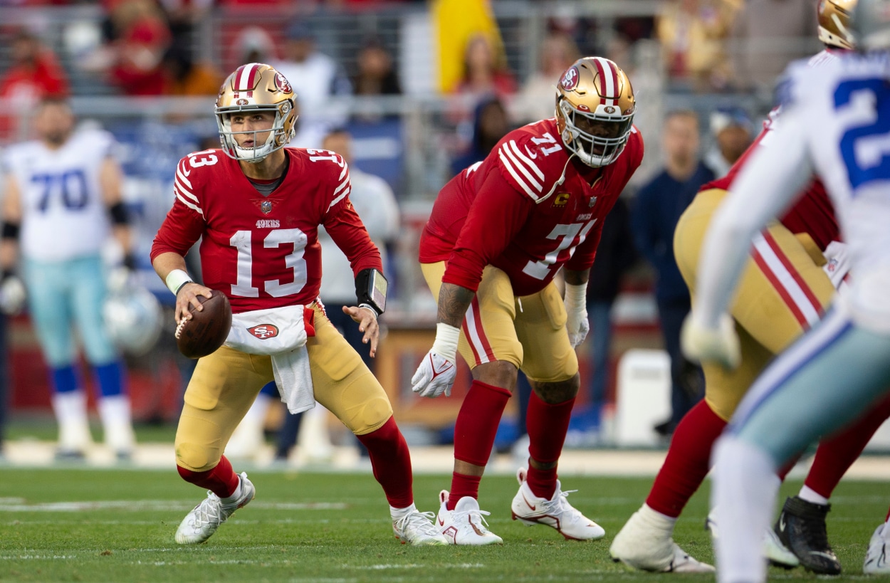 Brock Purdy of the San Francisco 49ers scrambles.