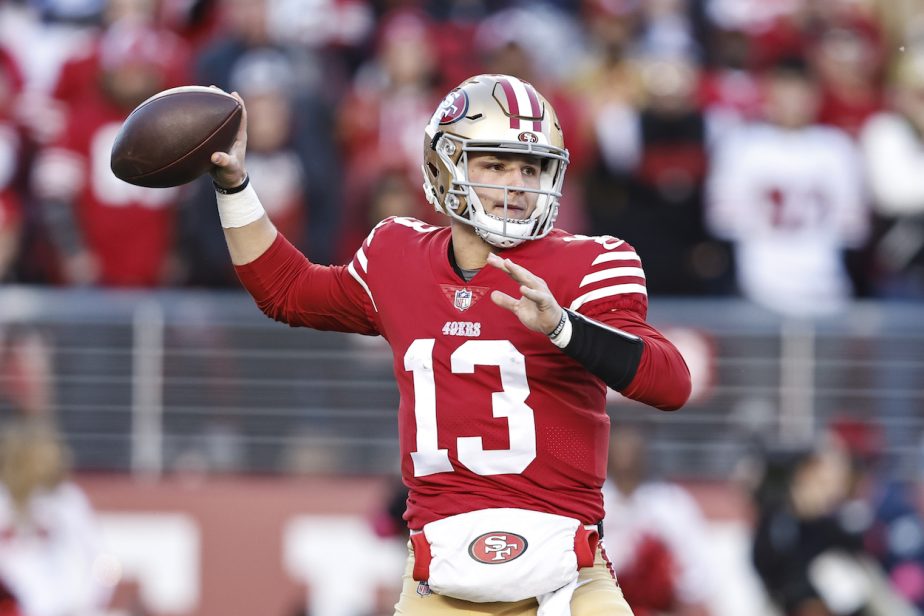 Brock Purdy attempts a pass against the Cowboys.