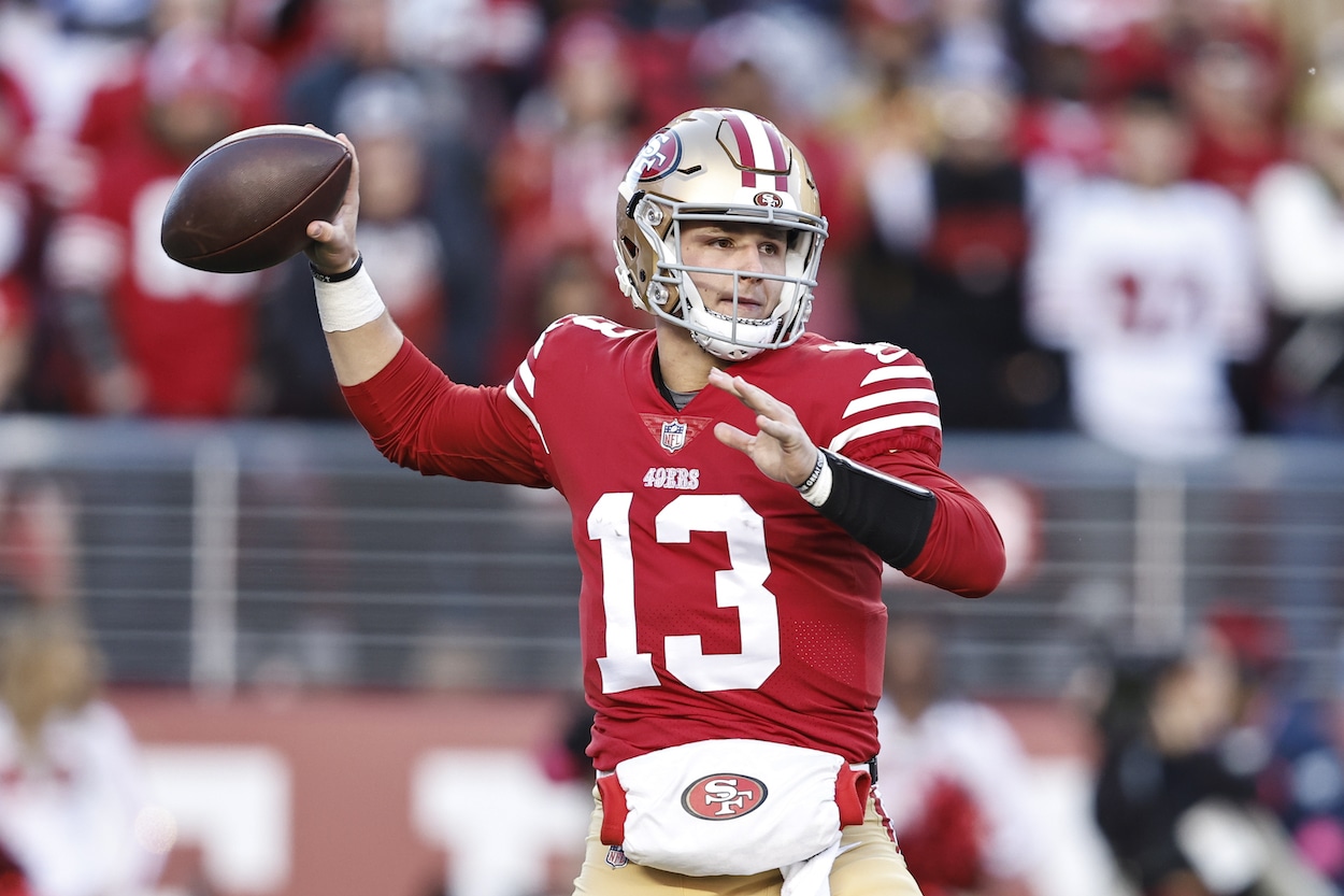 Brock Purdy attempts a pass against the Cowboys.