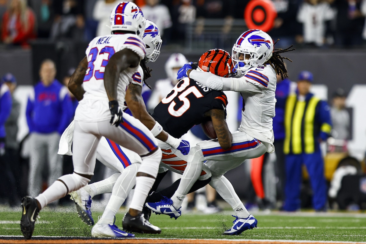 Damar Hamlin of the Buffalo Bills is tackled by Tee Higgins of the Cincinnati Bengals